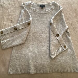 Gray sweater with button shoulder decorations